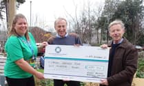 Giant Christmas Charity Market organisers present cheque to hospital