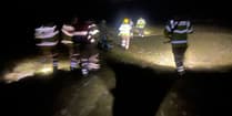 Firefighters save woman from mud