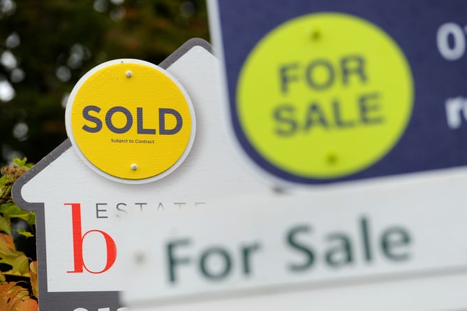 EMBARGOED TO 00001 TUESDAY OCTOBER 26 File photo dated 14/10/14 of estate agents boards. The housing market is set to record its highest level of sales this year since 2007, according to a property website. Issue date: Tuesday October 26, 2021.