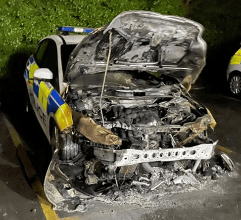 Hampshire Police is appealing for witnesses to come forward after a police car was set on fire in the car park at Alton Police Station on Monday