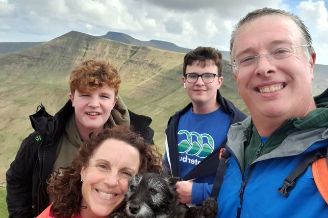 Laine Skinner with wife Sara, sons Aneurin (14, back left), Brynach (15 back centre), and family dog Scamp.