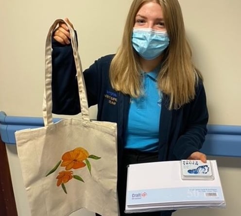 Pictured with some of the bereavement items is Honey Owens, Patient Experience Apprentice