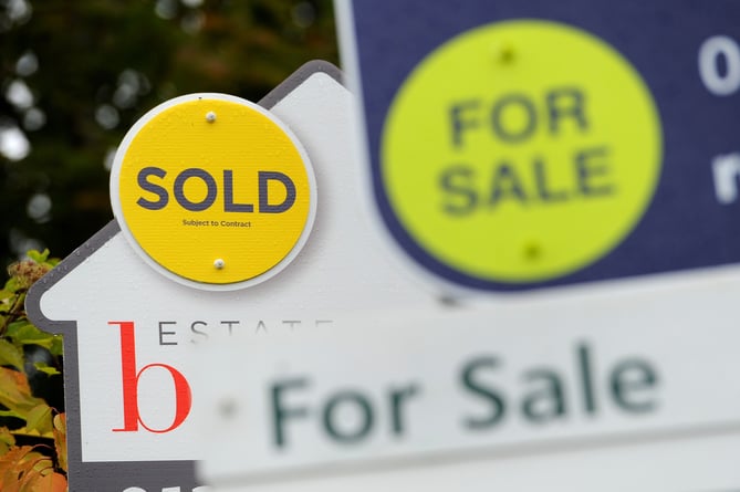 File photo dated 14/10/14 of estate agents boards.