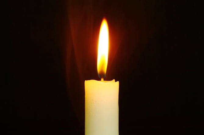 A candle lit at a church. 