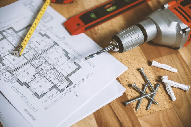 Photo of someone planning a building.