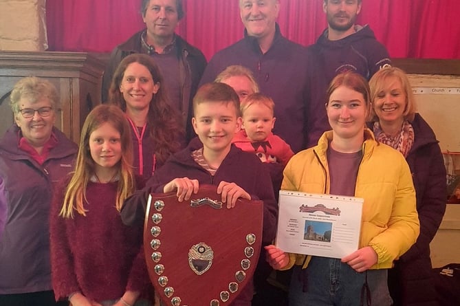 Chagford’s winning team, centre is the Tower Captain Jon Bint, his daughter Holly (in yellow) and 13 years-old Ewan Kaczanow.  Photo: Teresa Pearce
