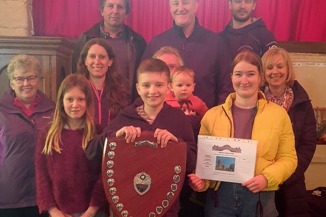 Chagford’s winning team, centre is the Tower Captain Jon Bint, his daughter Holly (in yellow) and 13 years-old Ewan Kaczanow. Photo: Teresa Pearce