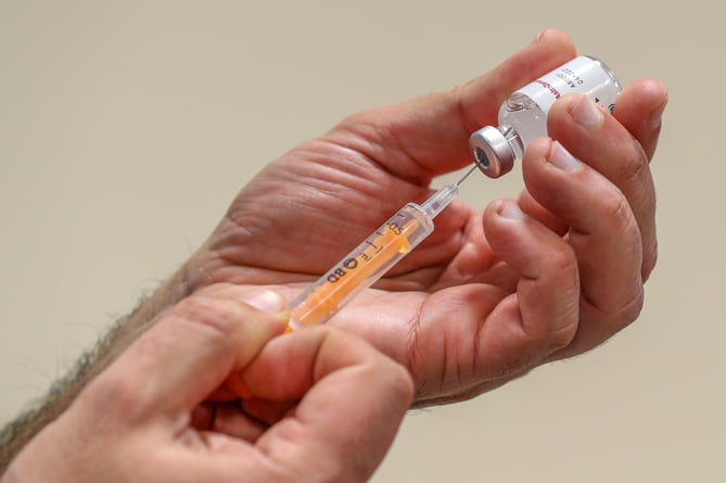 NHS staff prepare to administer a Oxford/AstraZeneca Covid-19 vaccine at the Depaul UK homeless shelter in Oldham, Greater Manchester.