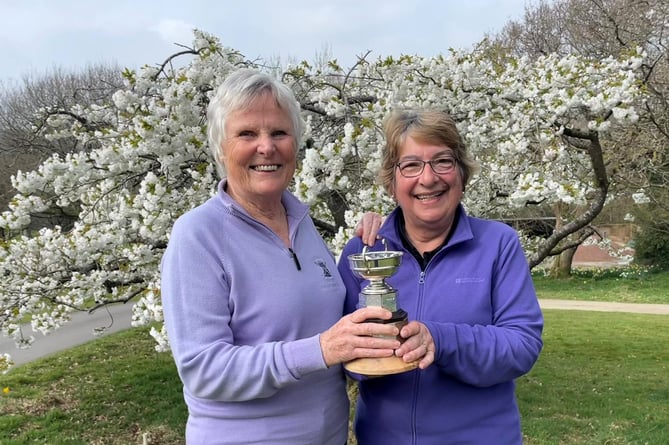 Lady Captain Judith Ezard, left, presenting the Par Cup to Diana Johnson.