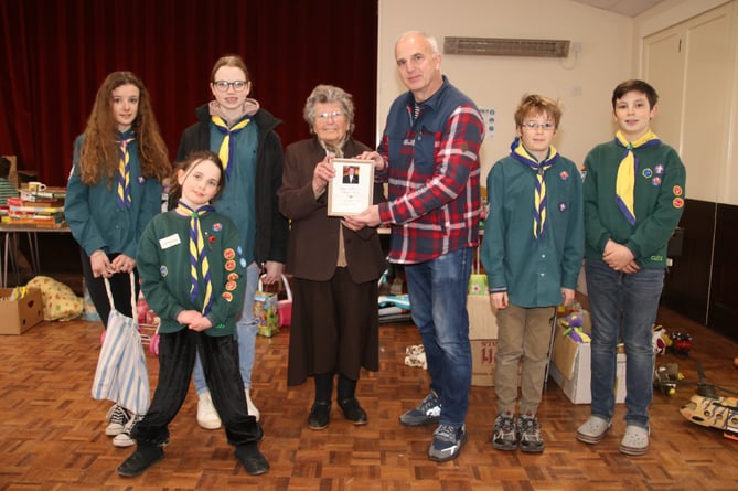 Margaret Phillips presenting Steve Haley, Sandford Scouts Chairman, with her First Sandford Scout Secretary Badge, from 1955.  AQ 5765
