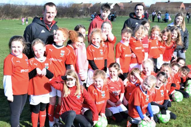 Talgarth Town Juniors FC girls proudly sporting their new kit, donated by Brecon’s Monmouthshire Building Society