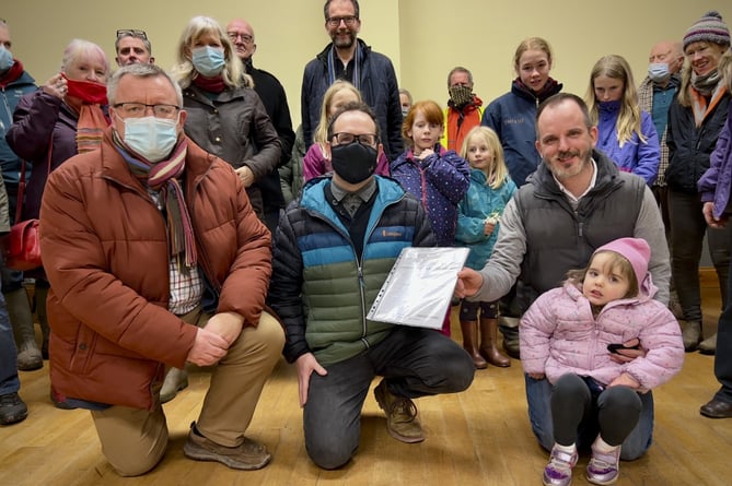 William Lloyd (centre) with Cllr William Powell (left) and Cllr Gareth Ratcliffe (right) with petition supporters