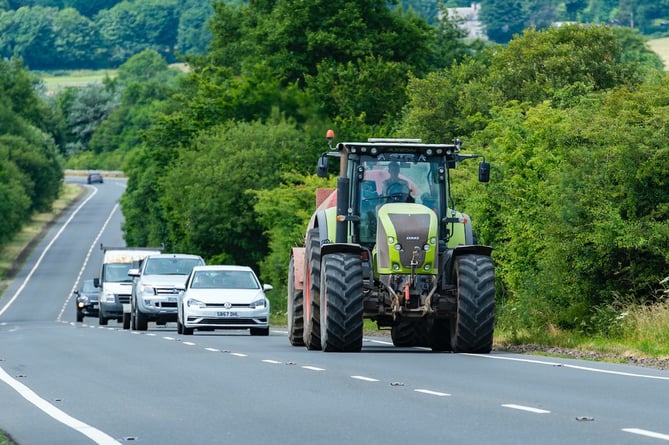 Queue of traffic behind a tractor