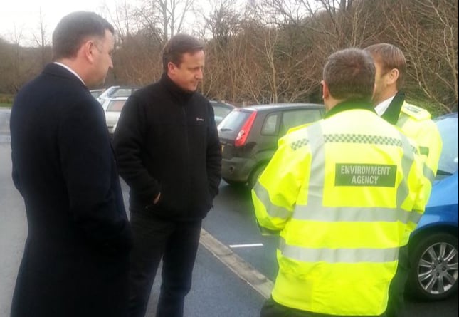 FLASHBACK: MP Mel Stride and David Cameron at the scenes of flooding in Buckfastleigh in 2012.