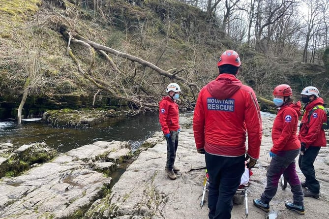 The Central Beacons MRT volunteers assisting the injured woman