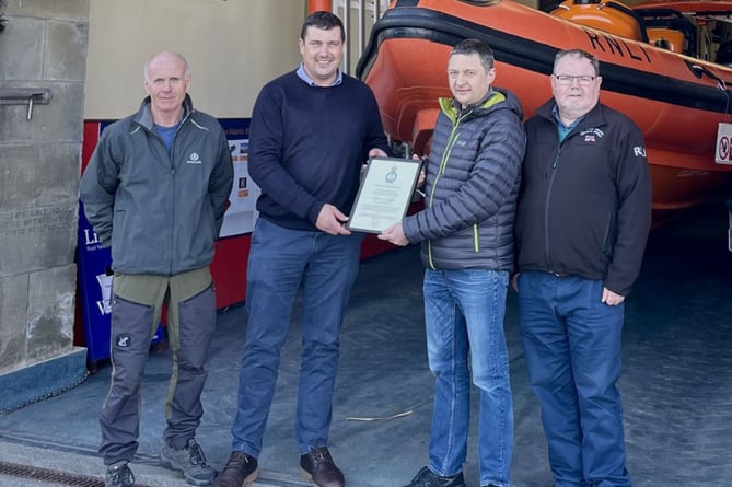 Pictured from left to right are: Lifeboat operations manager, Clive Moore, Area lifesaving manager, Andy Dodd, former lifeboat operations manager, Chris Fisher and chairman Peter Williams