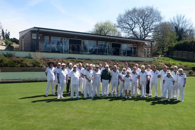 Members gather on the green with the clubhouse behind them at the opening of North Tawton Bowling Club. SR 1571