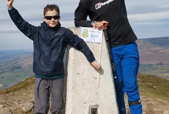Dante, 10, with TV star Ed on top of the Sugarloaf during his mammoth challenge