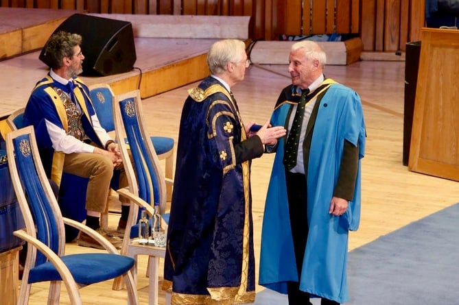 William Lyons receiving his degree.