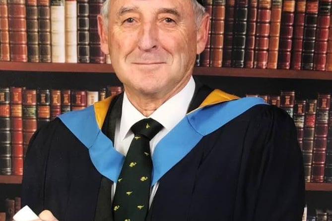 William Lyons with degree in 2017.