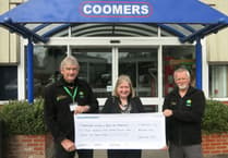 Coomers in Bordon presents chque to Hampshire and Isle of Wight Air Ambulance