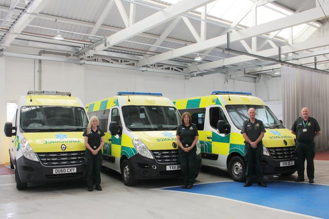 The three South Western Ambulance Service NHS Foundation Trust (SWASFT) vehicles donated to Ukraine, with, from left, paramedics Trudy, Kathy and Howard and event manager Des.