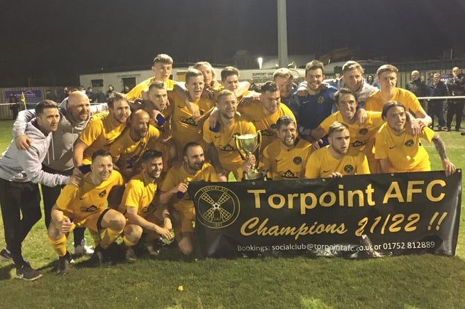 Torpoint’s players and coaches celebrate their title-winning success