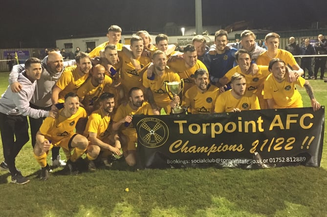 Torpoint’s players and coaches celebrate their title-winning success