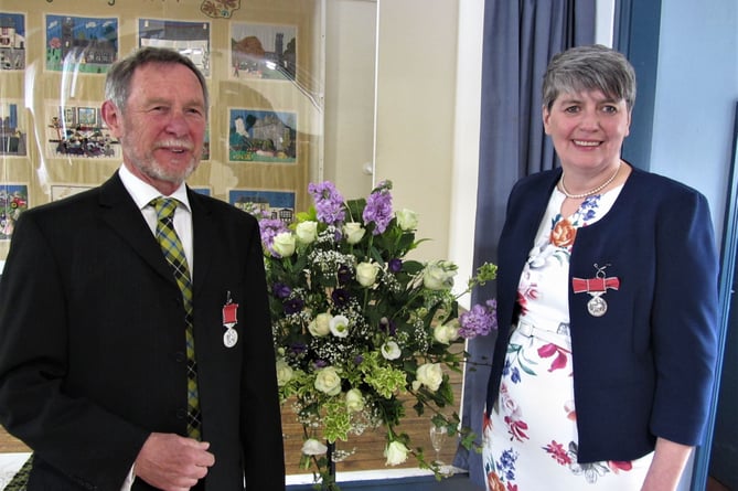Les Eastlake and Karen Roberts received the British Empire Medal (BEM) for their dedicated service to the community shop