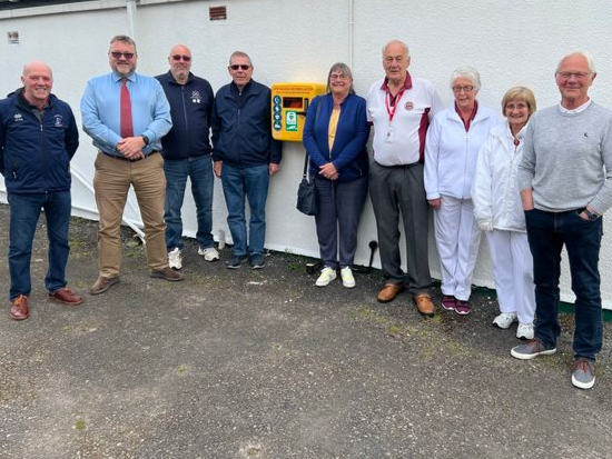 A NEW life-saving heart machine has been installed in Chudleigh thanks to heart attack survivor Nova Pusey. From the left are: Roger Harvey (chair of the football club), Wil Sprenkel (chair of the sports centre), Thierry Hacq (chair of Petanque), Doug Pusey, Nova Pusey, and representatives from Chudleigh Bowling Club, Mike Trout (sports centre treasurer).