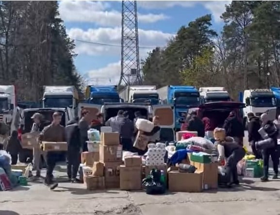 Volunteers in Poland unloading and sorting through some of the supplies brought by Darren’s third aid convoy from Cornwall and Devon