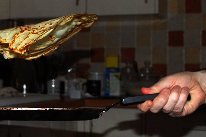 A pancake being tossed.