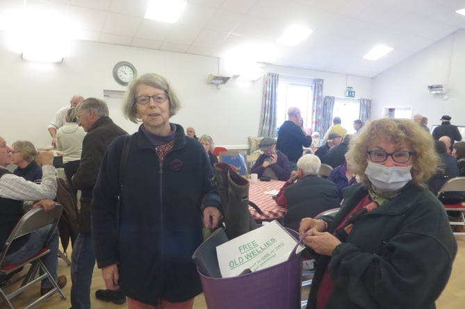 Garden Club members Pip O’Brien and Jean Alderton-Menz with the bucket of old wellies for planting. SR 1594