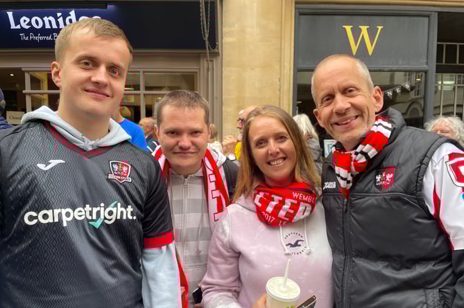 Crediton area supporters lining Exeter High Street to welcome the Grecians.