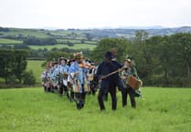 The Black Farmer dances through the summer with the Dartmoor Border Morris