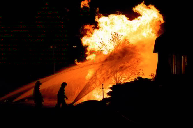 Firefighters at the scene of the gas explosion in Runcorn, Cheshire, which left four people badly burned.