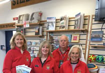 Volunteers handing out visitor guides