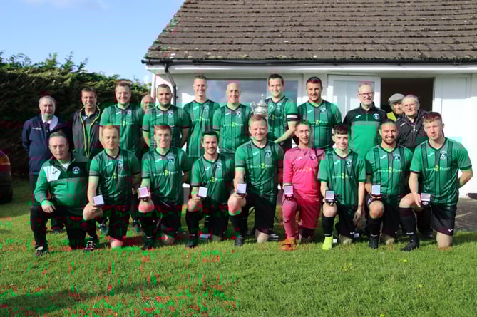 Lapford AFC after receiving the trophy with Chris Cole, standing left and Jim Sampson, standing right. AQ 6196