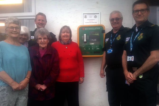 Presentation by Kilgetty WI of a defibrillator to the community.
