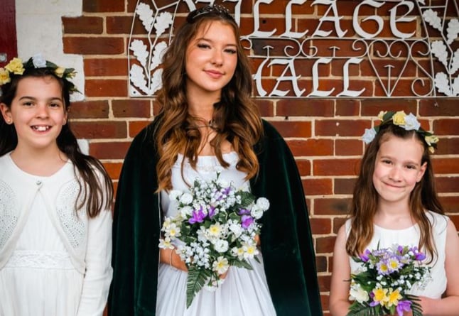 May Queen Kaitlyn Nicholson with her senior attendants Charlotte King and Madeline Lucus at the Oakhanger May Fayre 2022.