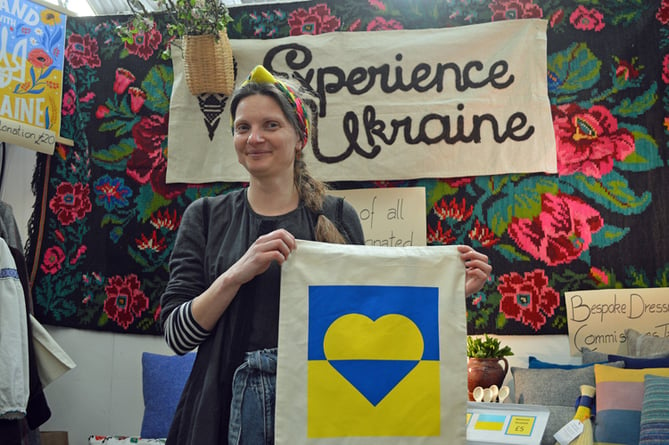  Nataliya Cummings from Experience Ukraine & Beyond with one of the bags bearing the flag of Ukraine