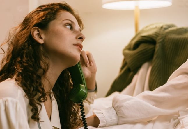 woman waiting on the phone