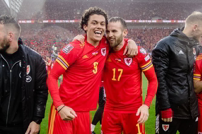 CARDIFF, WALES - 05 JUNE 2022: Wales' Brennan Johnson and Wales' Rhys Norrington-Davies celebrate after beating Ukraine 1-0 to book a place at the 2022 FIFA World Cup at the Cardiff City Stadium on the 5th of June 2022. (Pic by John Smith/FAW)