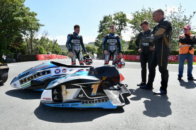 Ben and Tom Birchall and Tim Reeves and Kevin Rousseau at Sulby Bridge after the second Sidecar TT was red flagged