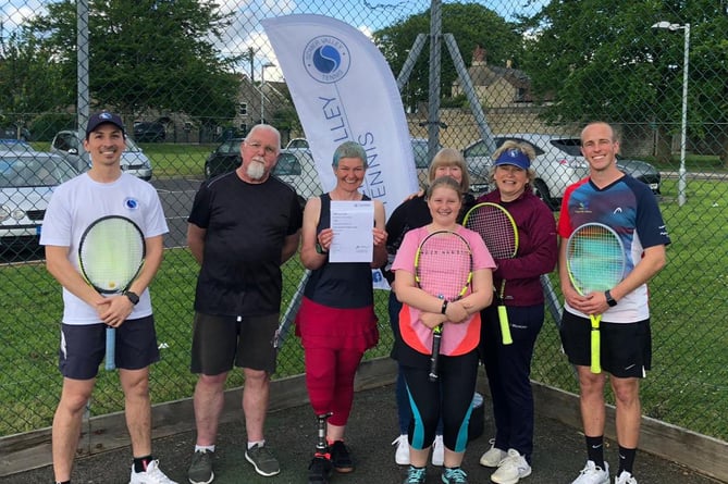 Members of Somer Valley Tennis Club celebrate becoming a charity. 