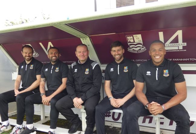 Sean Birchnall, centre, with the new faces in the Farnham Town dugout