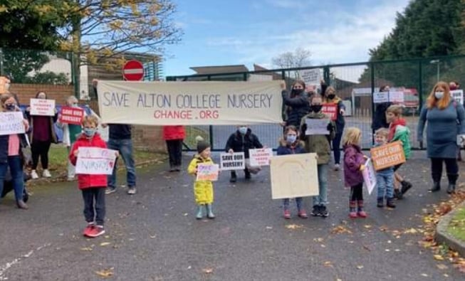 Children and parents protest against plans to close Alton College Nursery in October 2020.