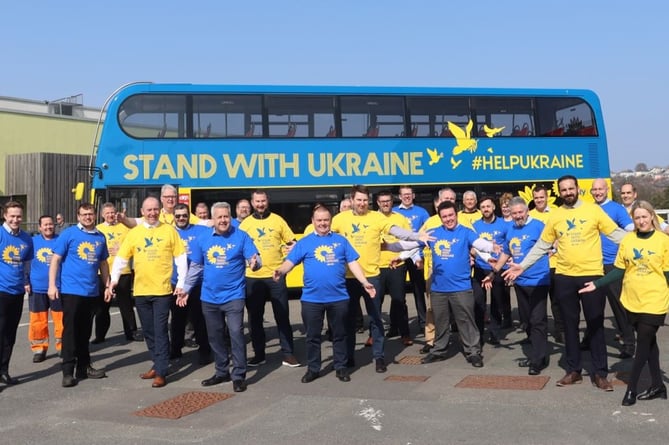 Go Cornwall Bus and Plymouth City Bus staff with the Peace Bus sporting the blue and yellow national colours of Ukraine