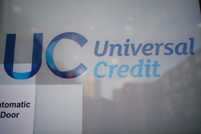 EMBARGOED TO 0001 THURSDAY JANUARY 13 File photo dated 06/10/21 of a Universal Credit sign on a door of a job centre plus. The Government should allow more than 100,000 disabled and ill people to seek compensation after a "blunder" saw their benefits mistakenly cut, an ombudsman has warned.
