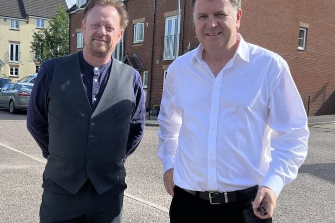 Mid Devon Councillor Stuart Penny discussing social housing in the district with Central Devon MP Mel Stride.